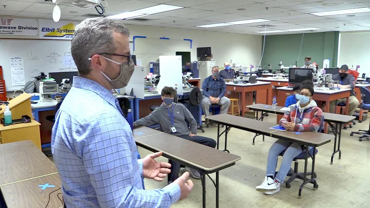 A KMC team member speaking at a local school.