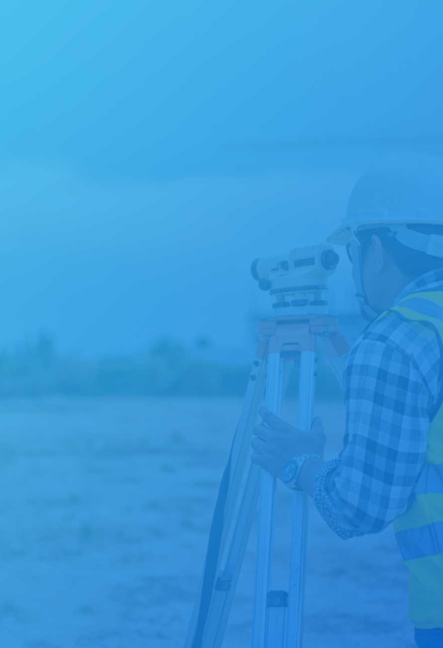 Man in hard hat surveying road with light blue overlay
