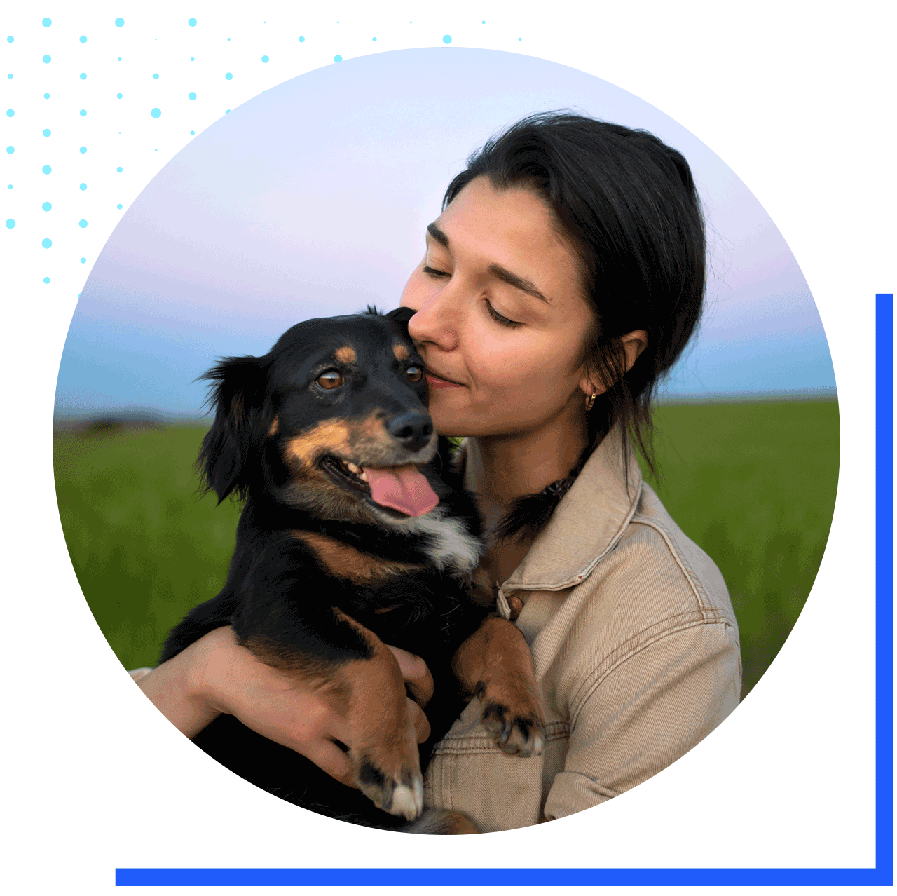 A woman gently holding her dog