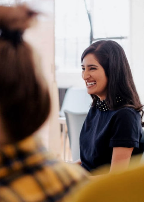 Image of a girl smiling in casual business attire