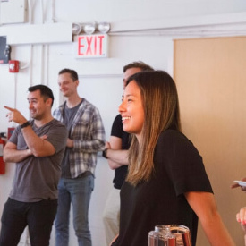 Image of employees at a meeting smiling