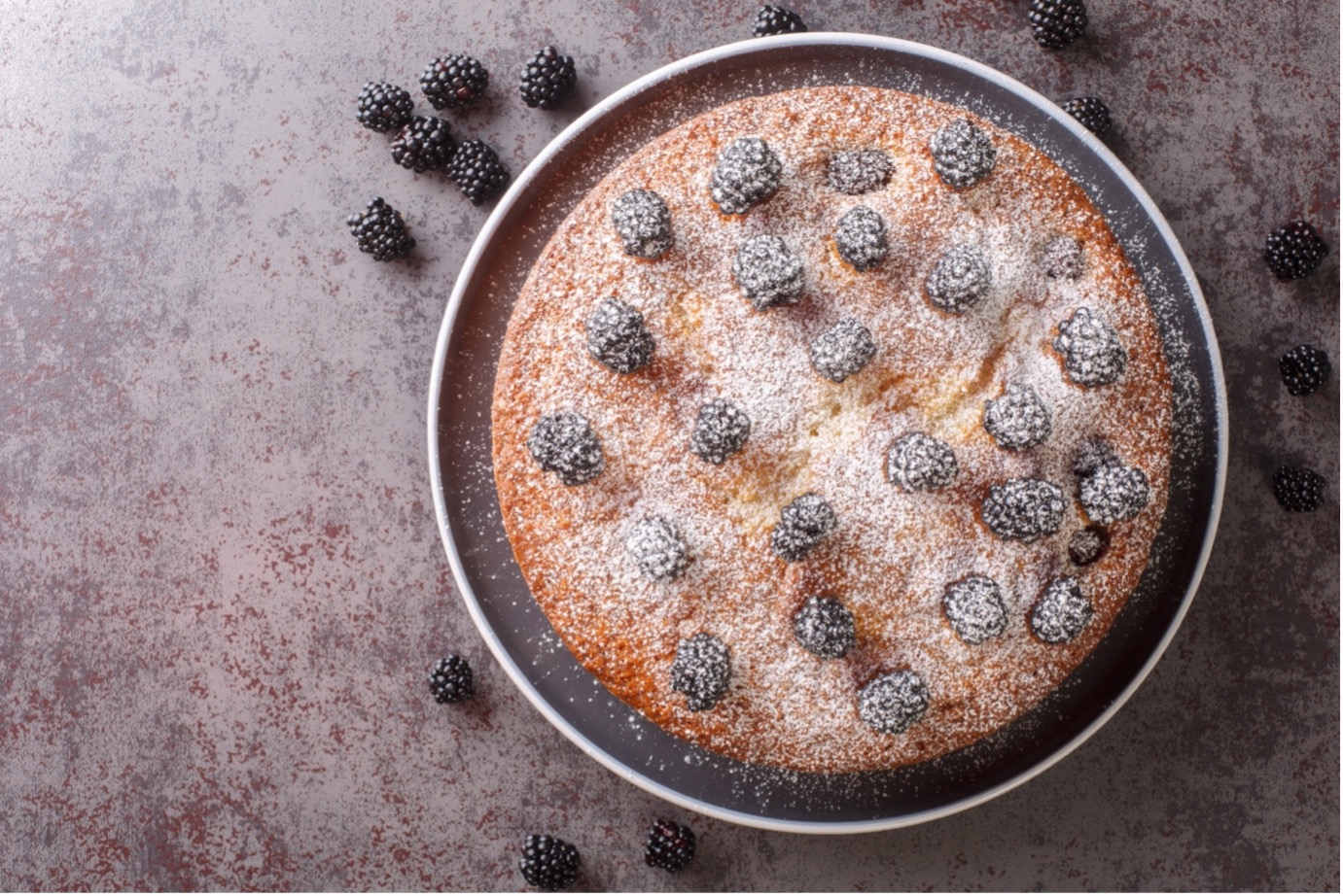 Recipe for Autumn Sloe Gin and Tonic Cake topped with Blackberries