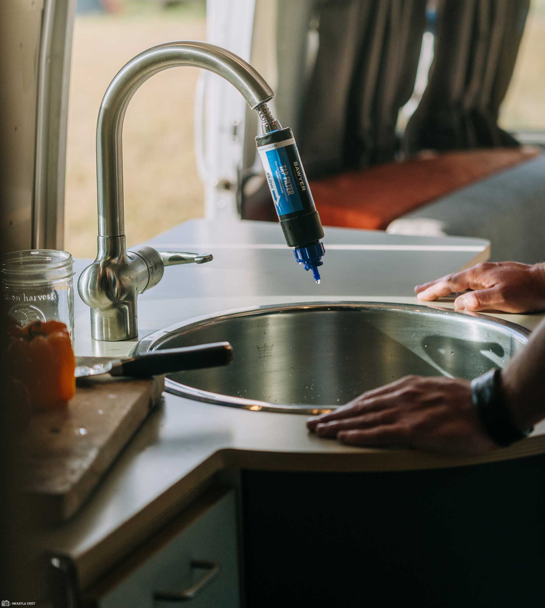 A Sawyer Tap Water Filter on a Tap in a RV