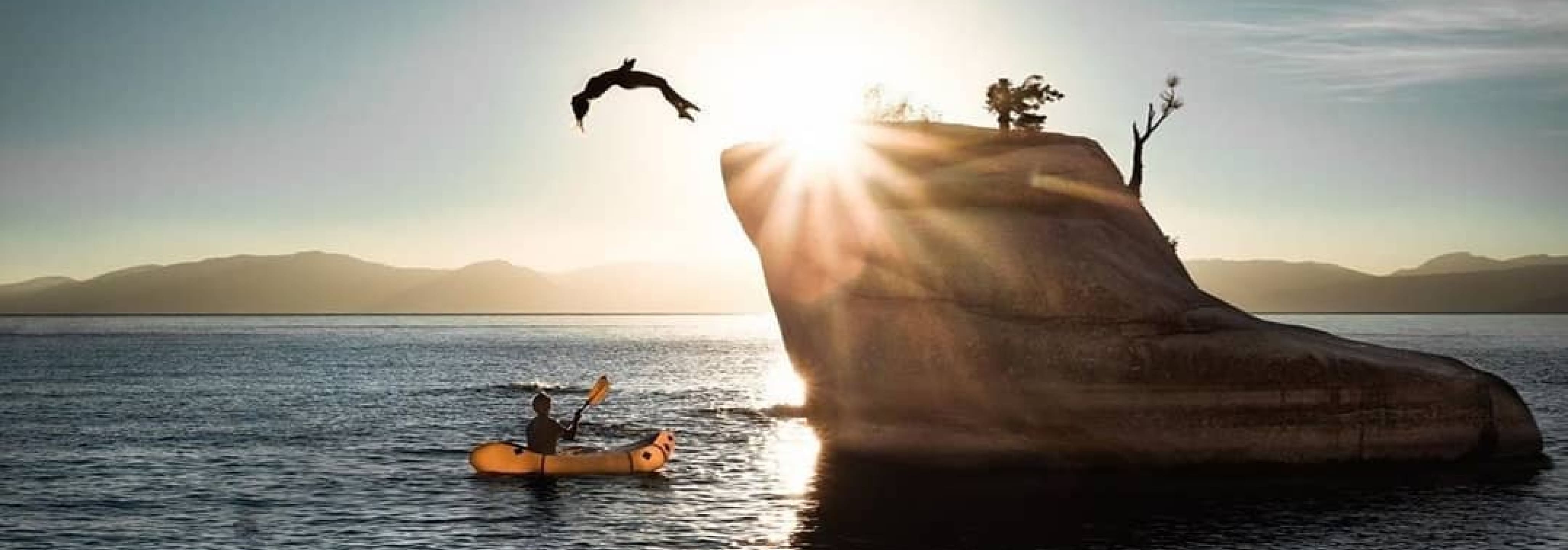 Instagram image showing a diver jumping off a small rock outcrop into the ocean.