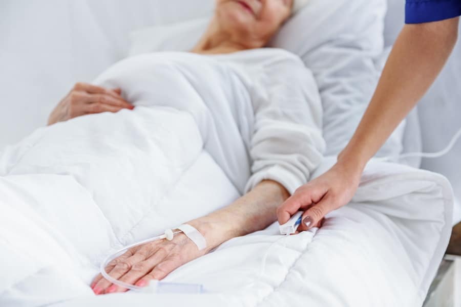 Older woman in hospital bed