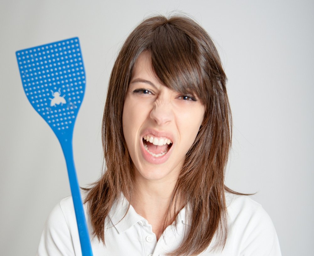 Woman with fly swatter