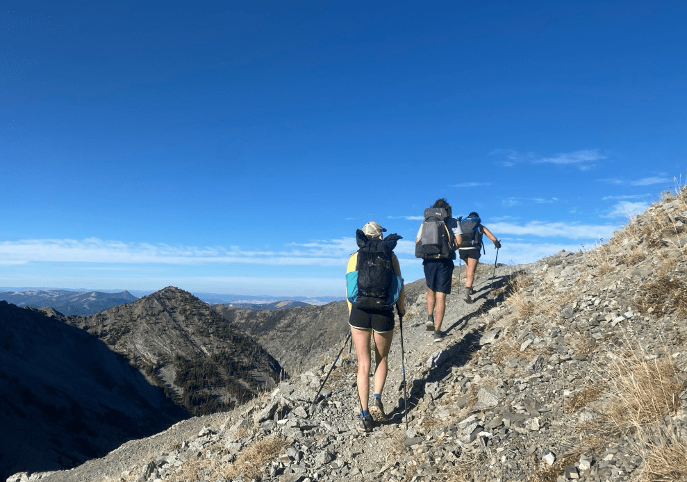 Three backpackers on trail