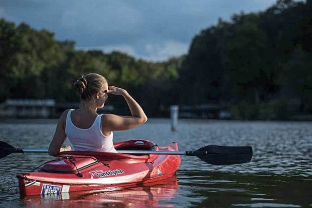 Woman in kayak on water