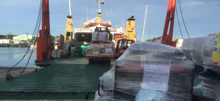 A boat being loaded with Caribbean relief