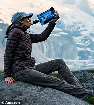 Woman drinking from Sawyer squeeze filter