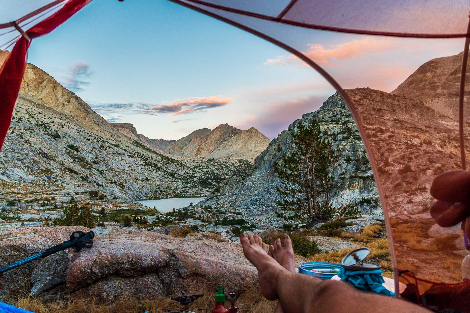 Person with feet sticking out tent door