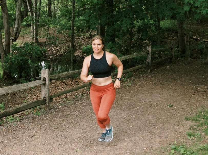 Katie Spotz running on trail