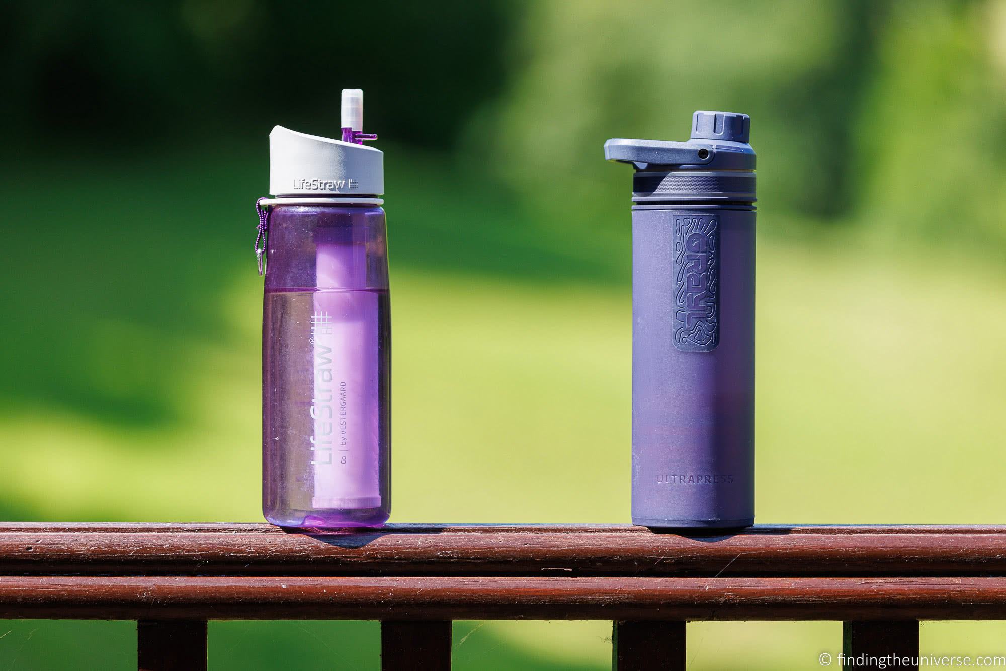 Grayl and Lifestraw Water bottle sitting on a wooden ledge