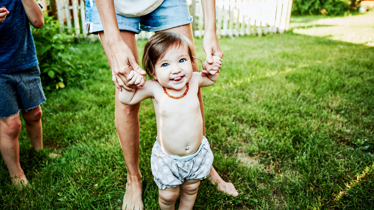 Mother holding infant daughter
