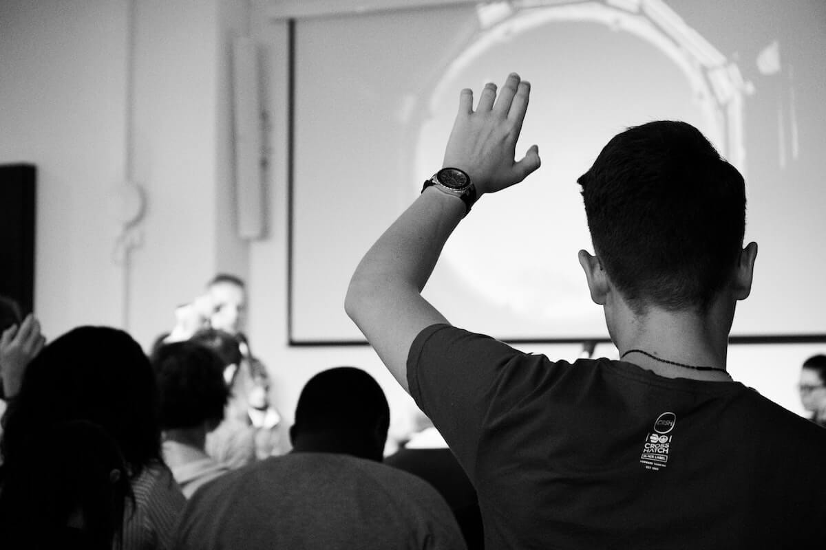 man in classroom raising his hand things they didn't tell you in nursing school