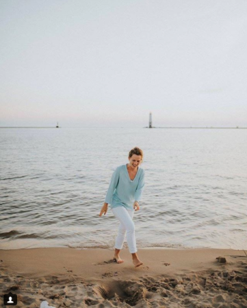 nurse monica gingell on the beach smiling