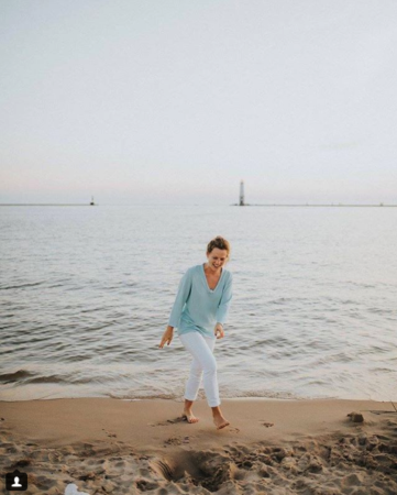 nurse monica gingell on the beach smiling 