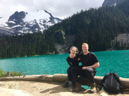 nurse monica gingell with partner in front of lake and trees