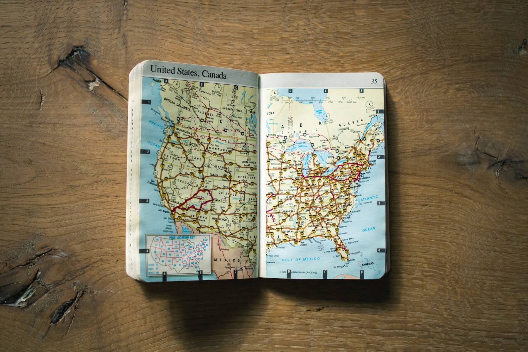 map book folded open on wood table map of united states nurse licensure compact states