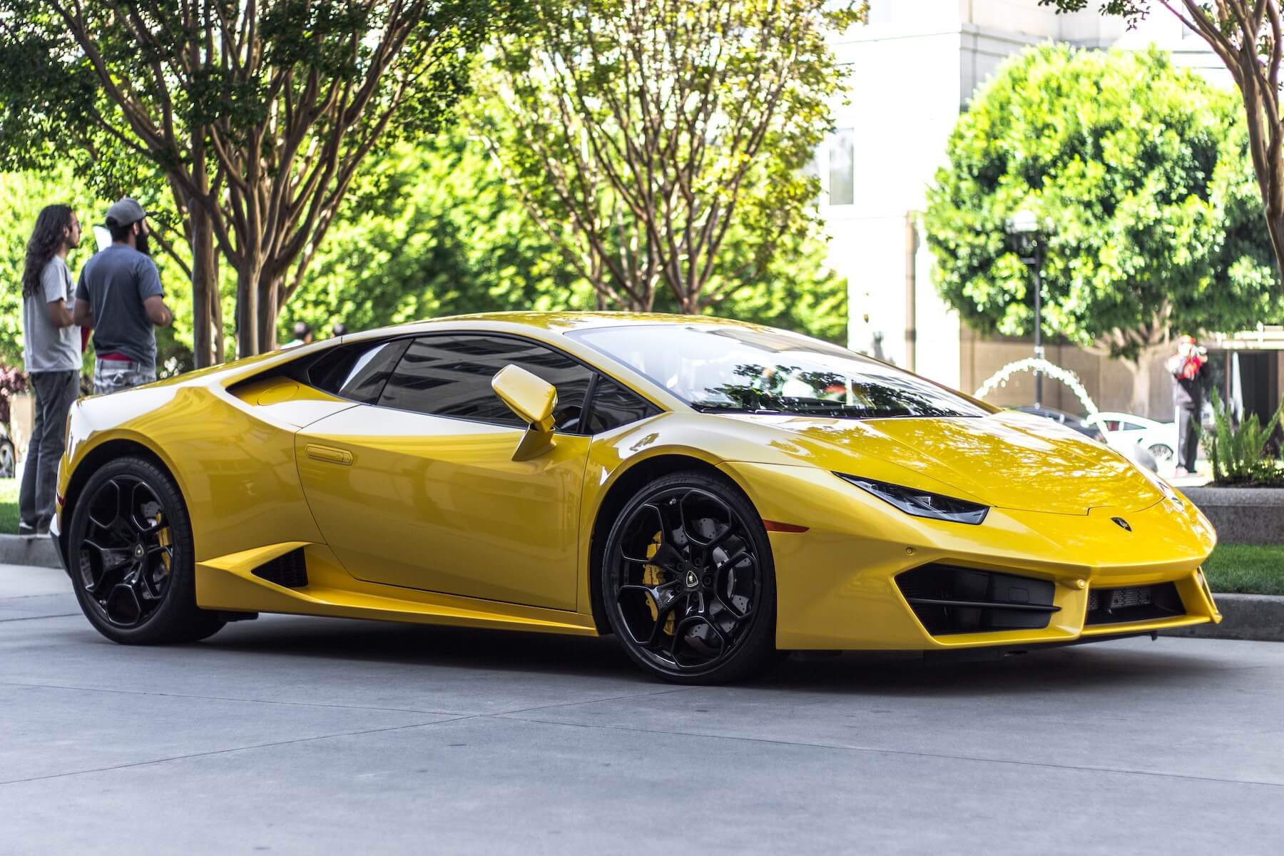 fancy car parked in hotel entrance car debt