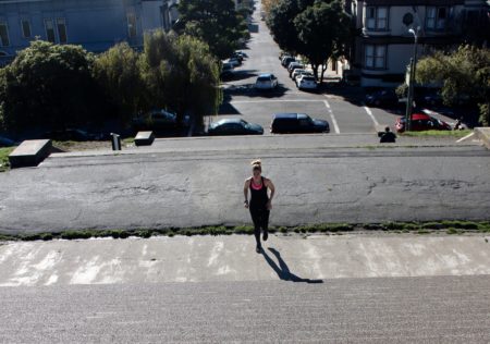 nurse erin kilyroy runs up alta plaza park steps in san francisco