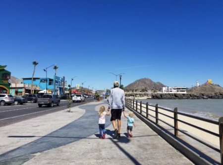 russ mortland nomadic nurse and children on boardwalk