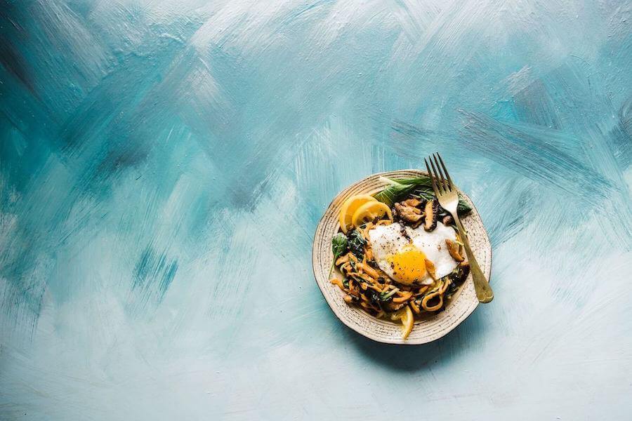 plate of food on blue background traveling food travel food