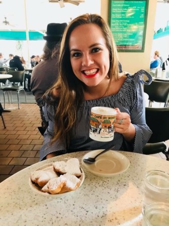 nurse leah gnitka sitting in cafe with coffee