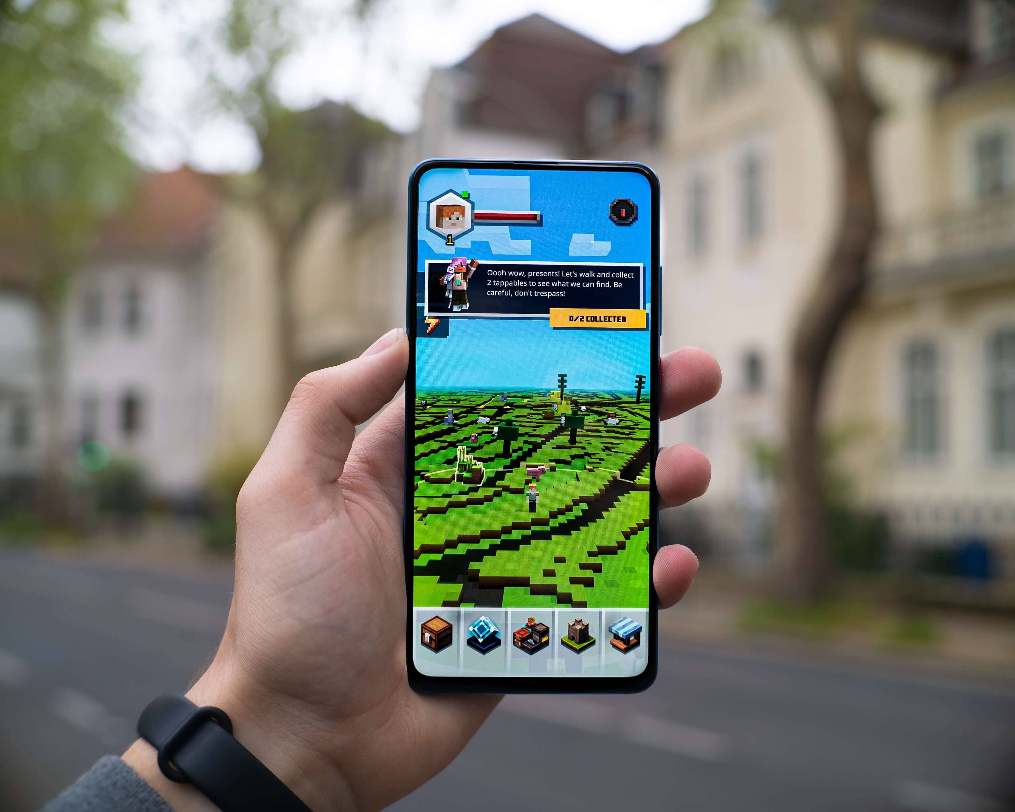 a man plays a game on his phone