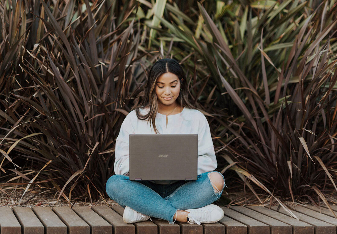 a woman works on a computer