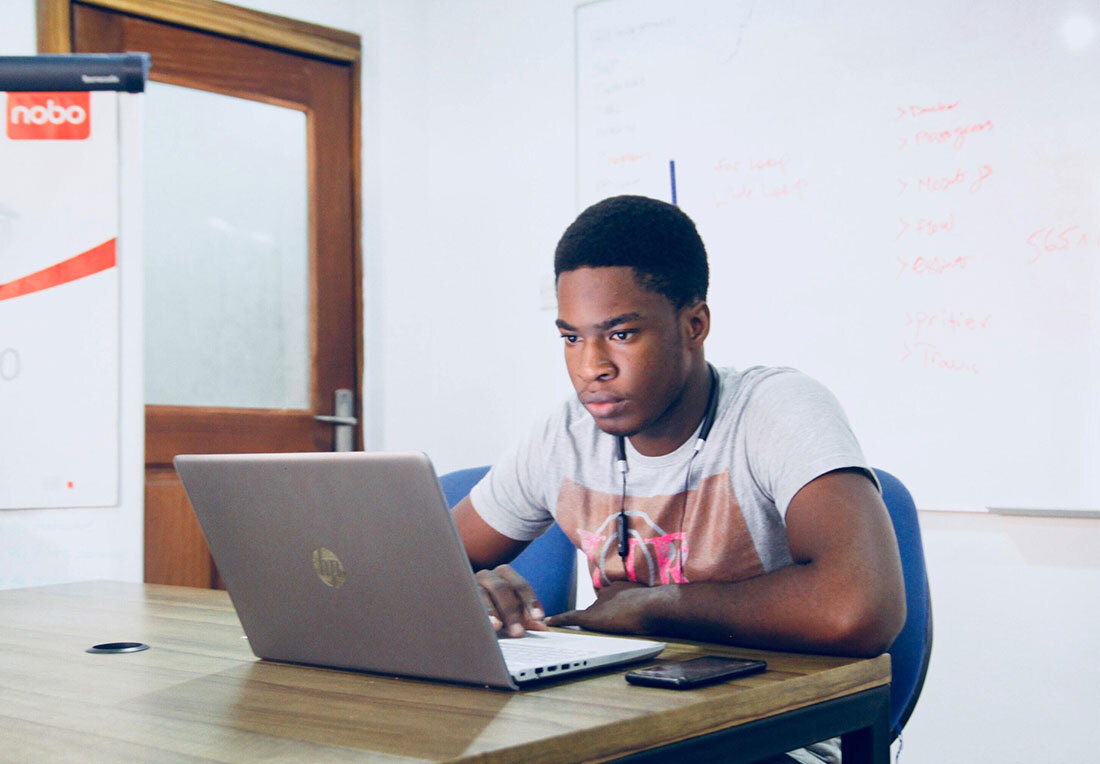 man works on a computer