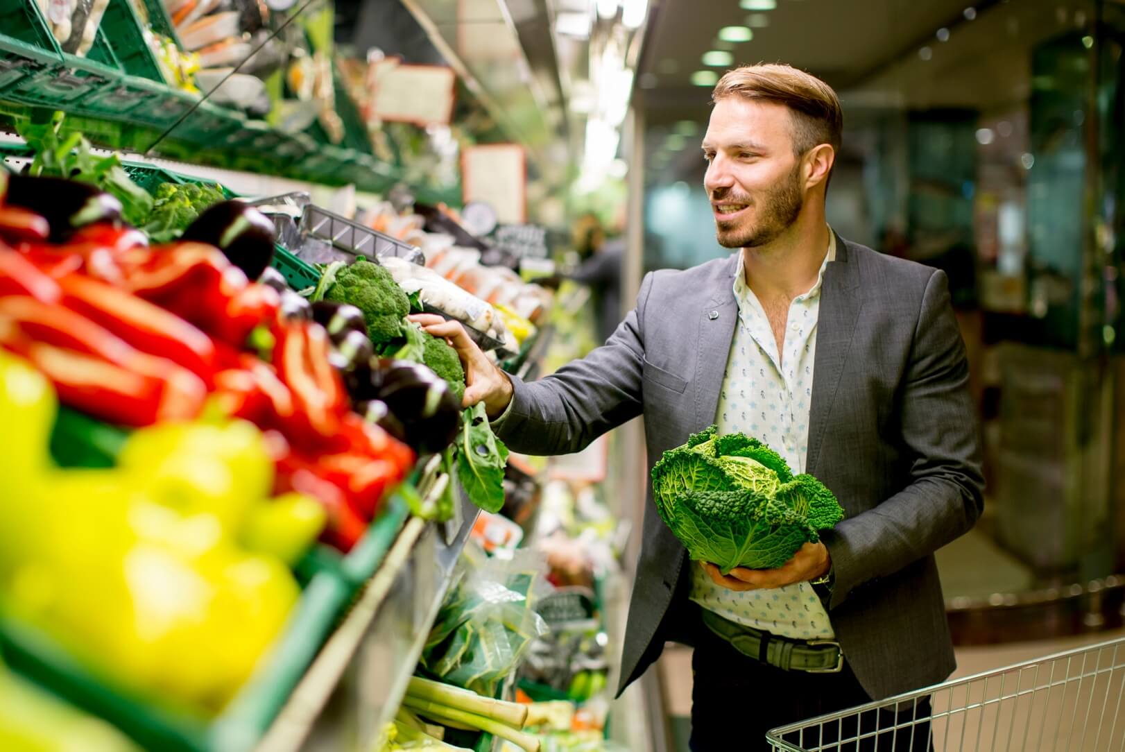 A person shopping to show the best way to save money on groceries.