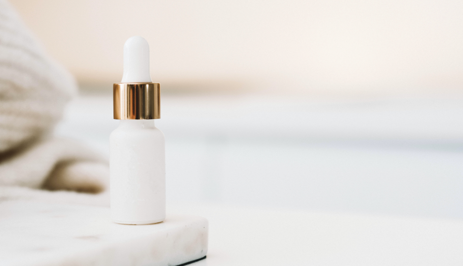 Picture of a white cosmetics bottle on a table