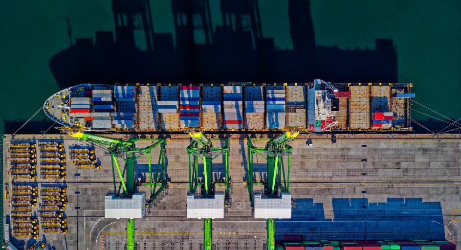image of a freight ship being filled with cargo