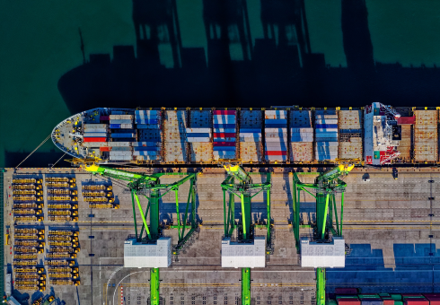 image of a freight ship being filled with cargo
