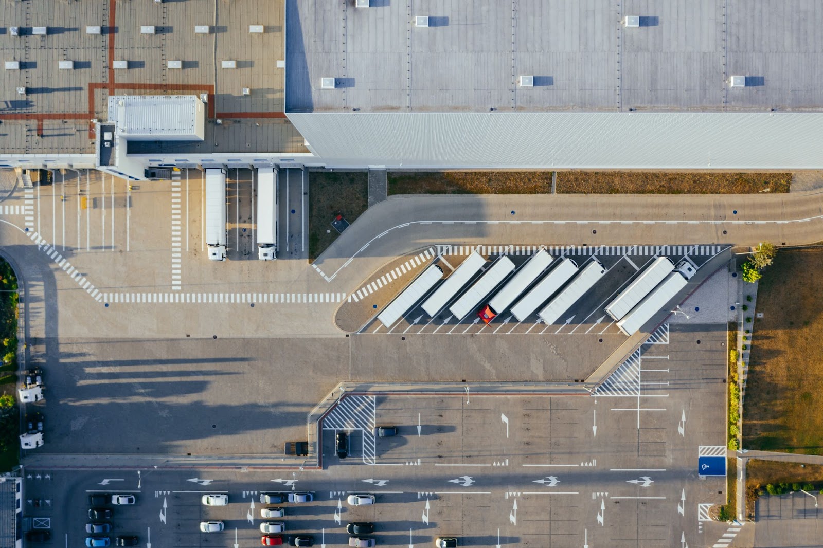 Image of trucks waiting outside fulfillment center to take packages to customers