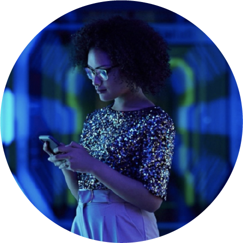 Woman staring down at smartphone in her hands