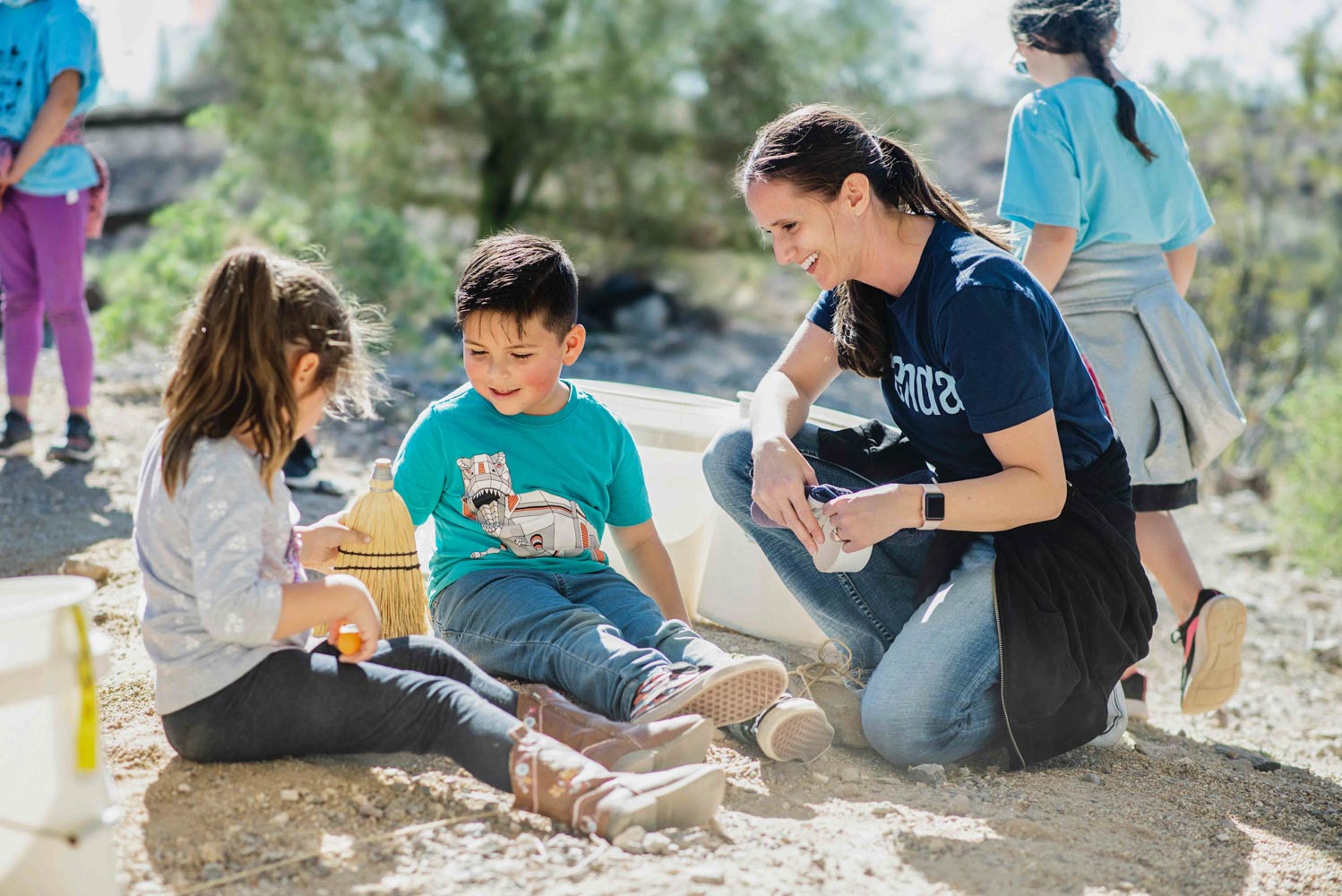 Two Prenda students in Arizona collaborating on a hands-on fossil project outside.