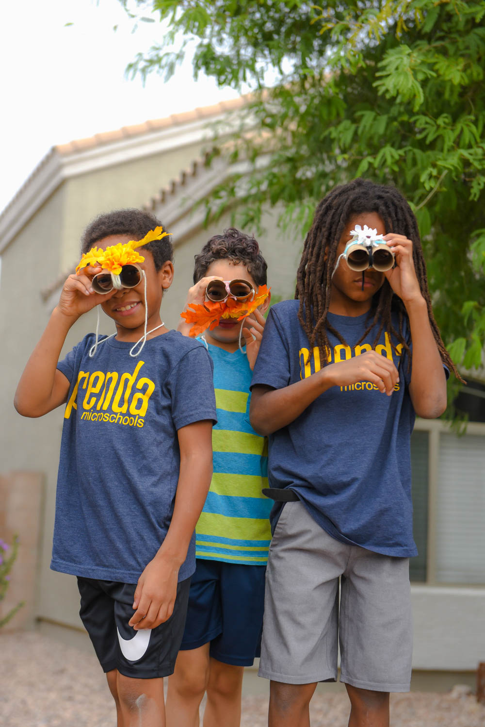 Prenda students with binoculars