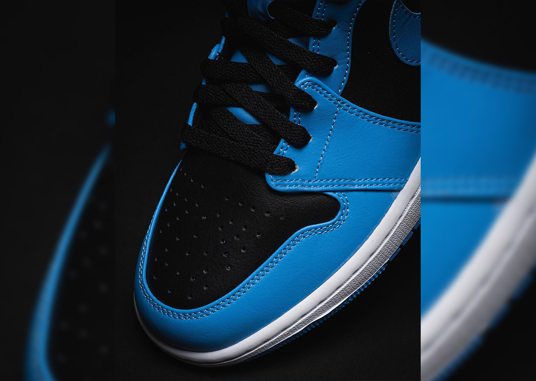 university blue jordans mid