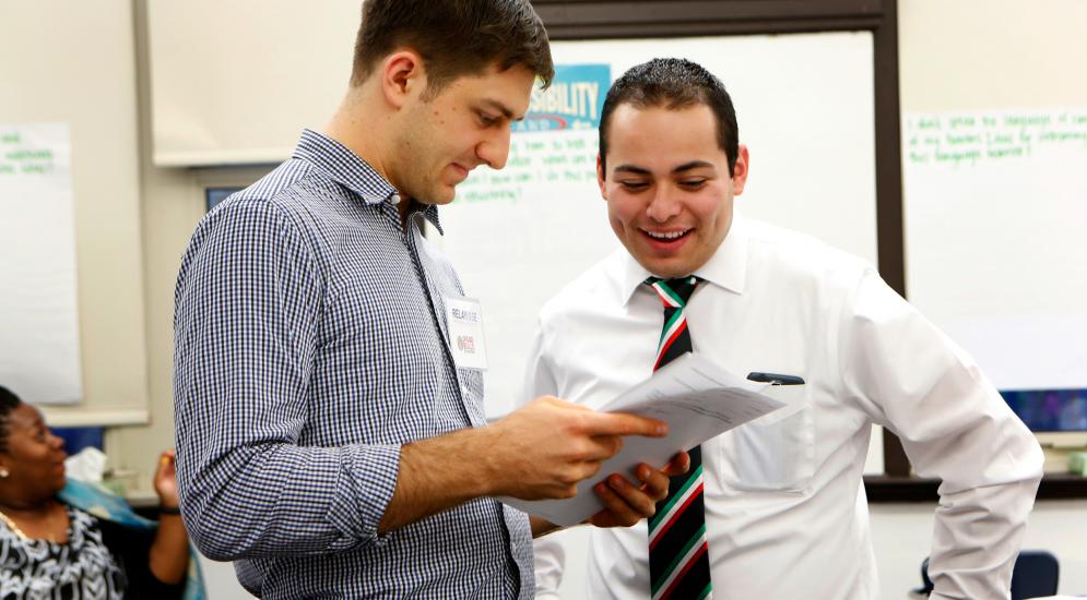 Leadership instructor talking one-on-one with student.