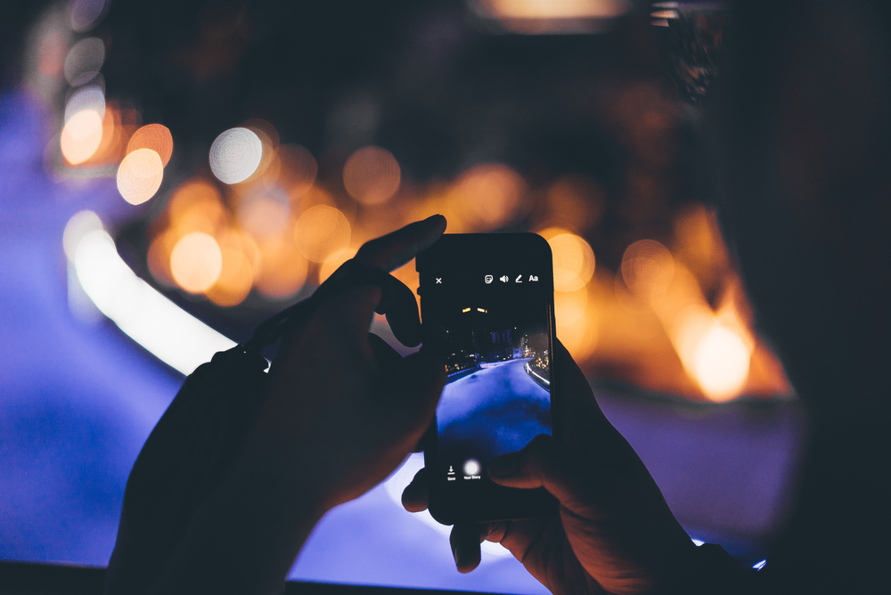 Closeup of someone adding an Instagram story.