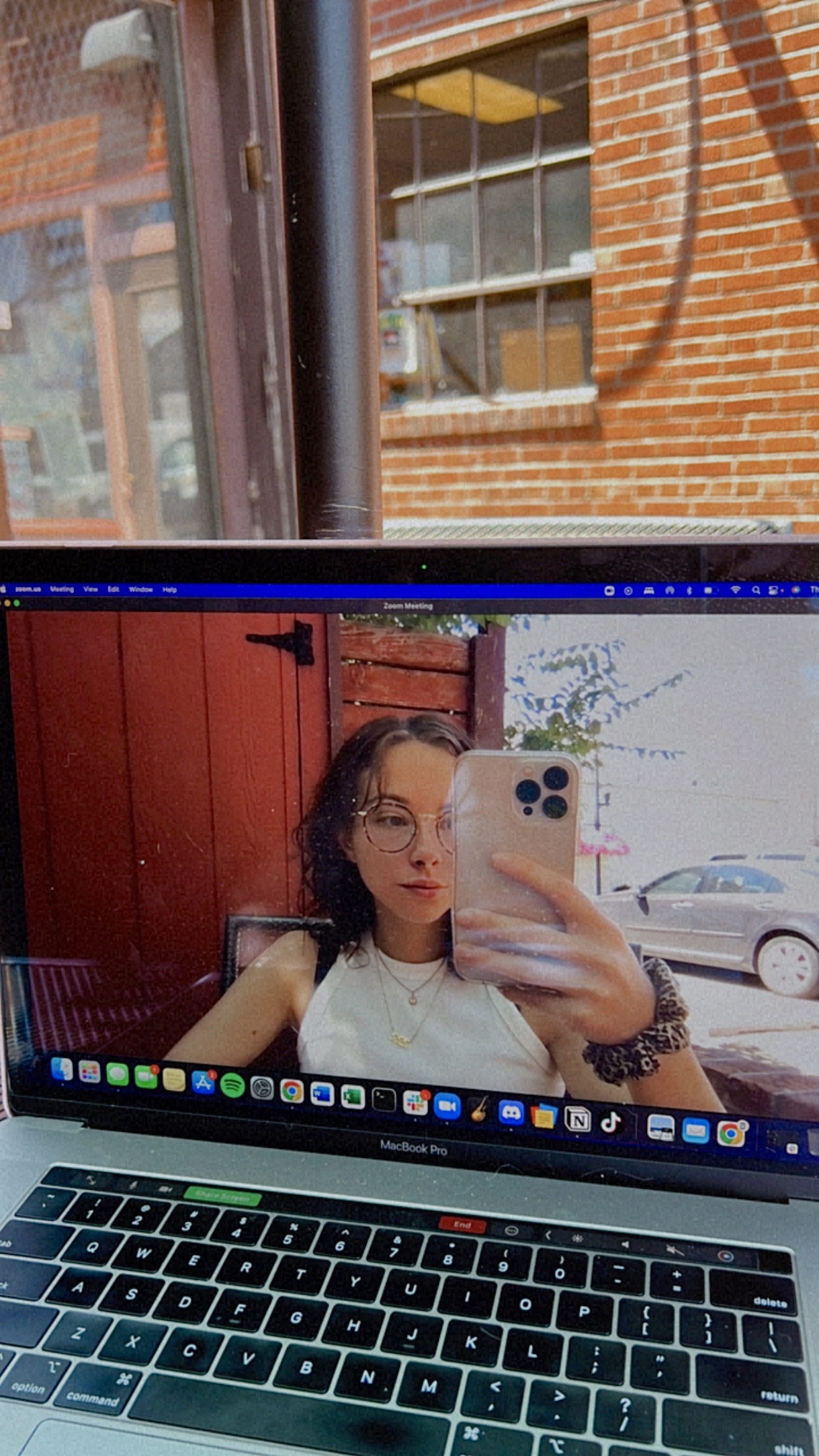 Selfie of Gabrielle Judge on a computer screen