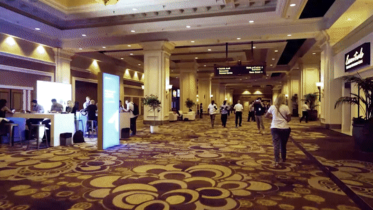 Silver Fox Productions onsite design support: people walking around at a conference venue