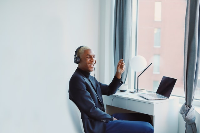 Smiling man enjoying a virtual event