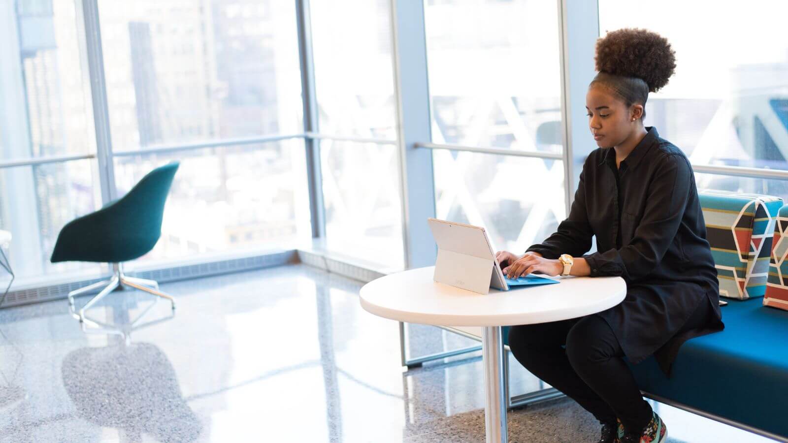 Woman working on tablet in a common area