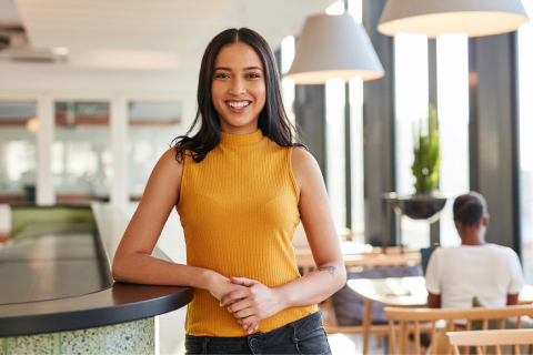 A young professional with a big smile on her face