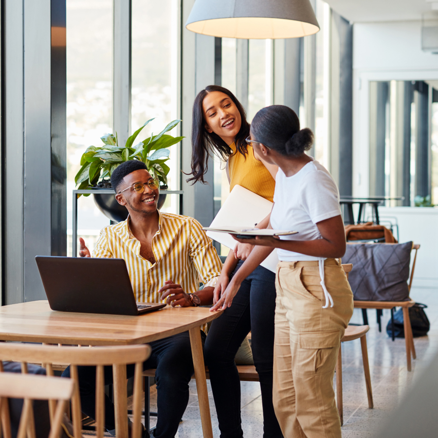 Image of three young professionals working together