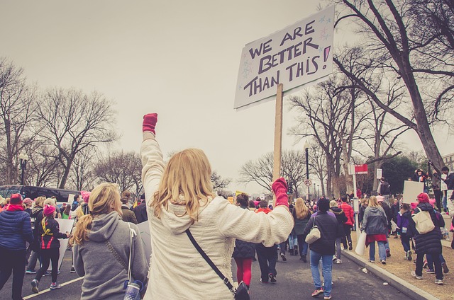 woman holding sign at protest