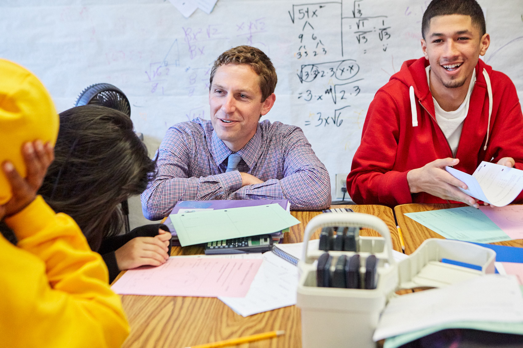 New Leaders teacher in discussion with students